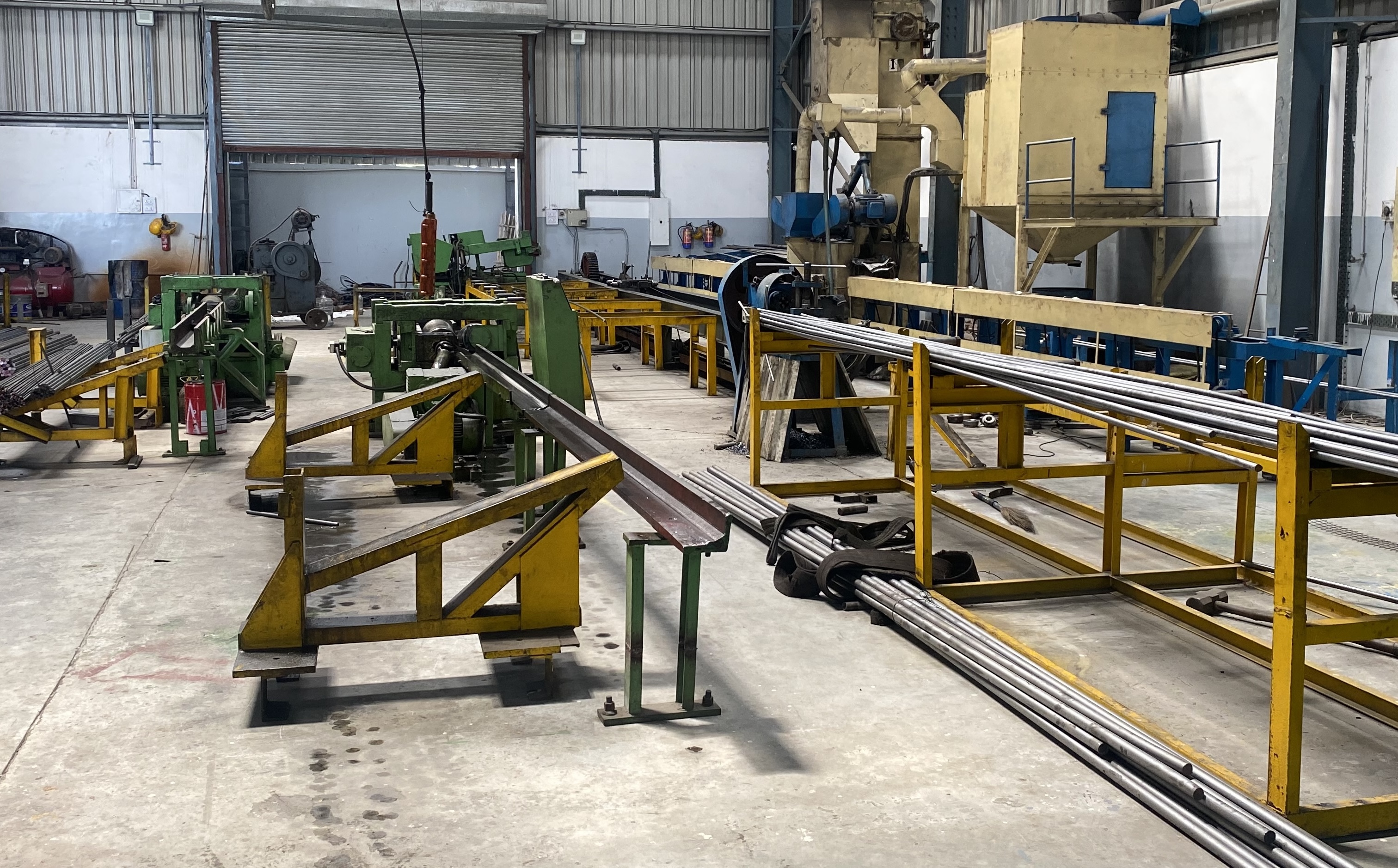 The interior of the Marbrite Steel manufacturing facility in Delhi, showing machinery for cold drawing bright bars.